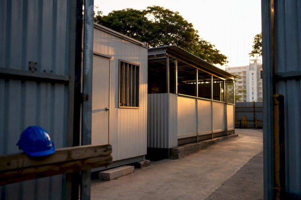 Temporary container office and shed at construction site