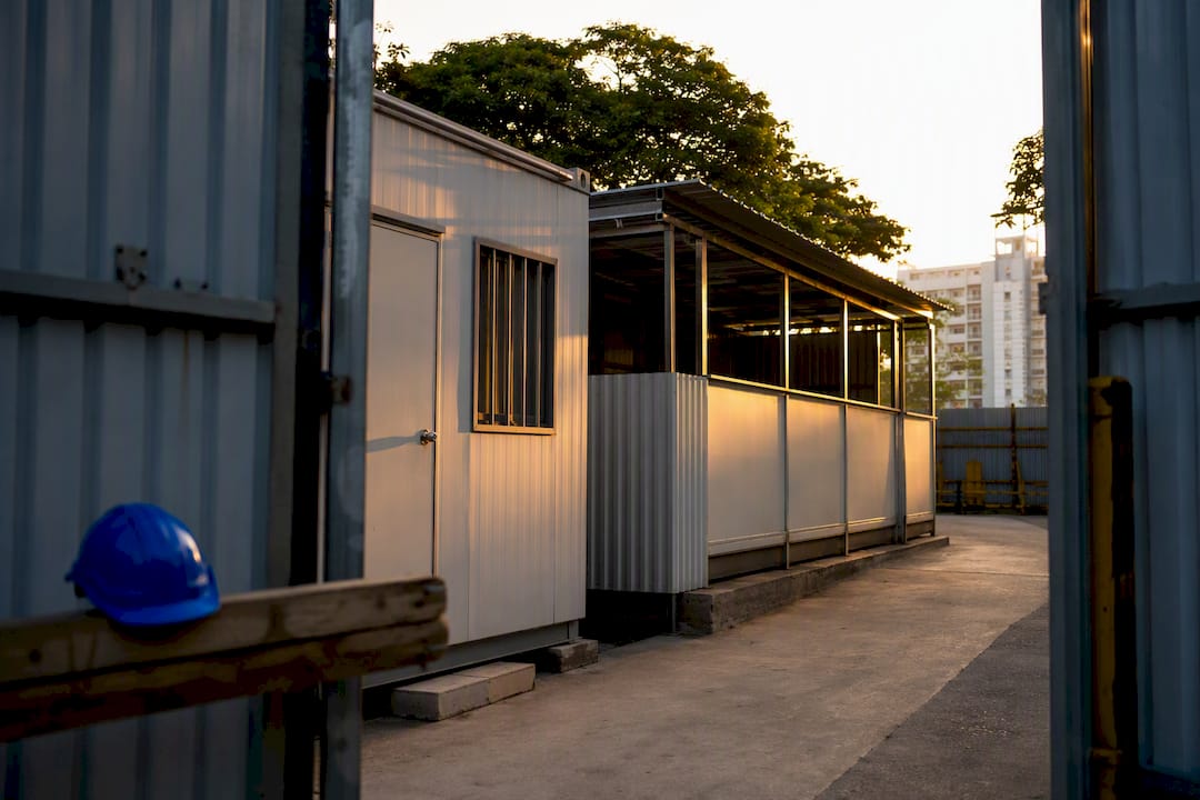 Temporary container office and shed at construction site