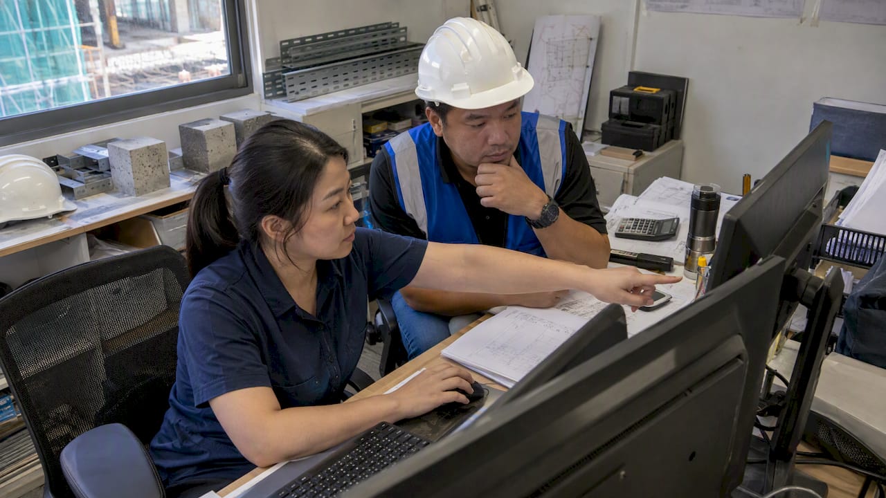 Project team validating BIM quantities against estimate