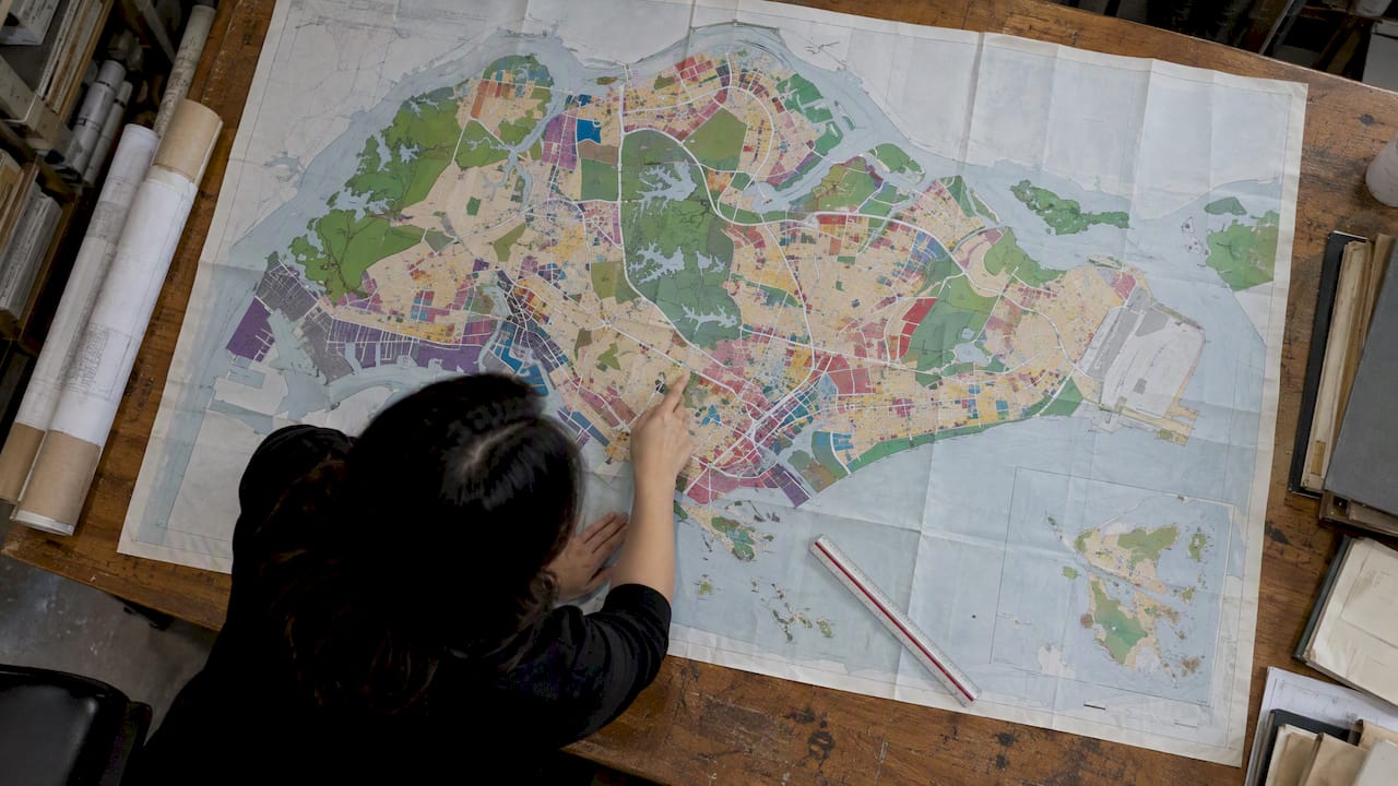 Singapore land-use map spread across planning table