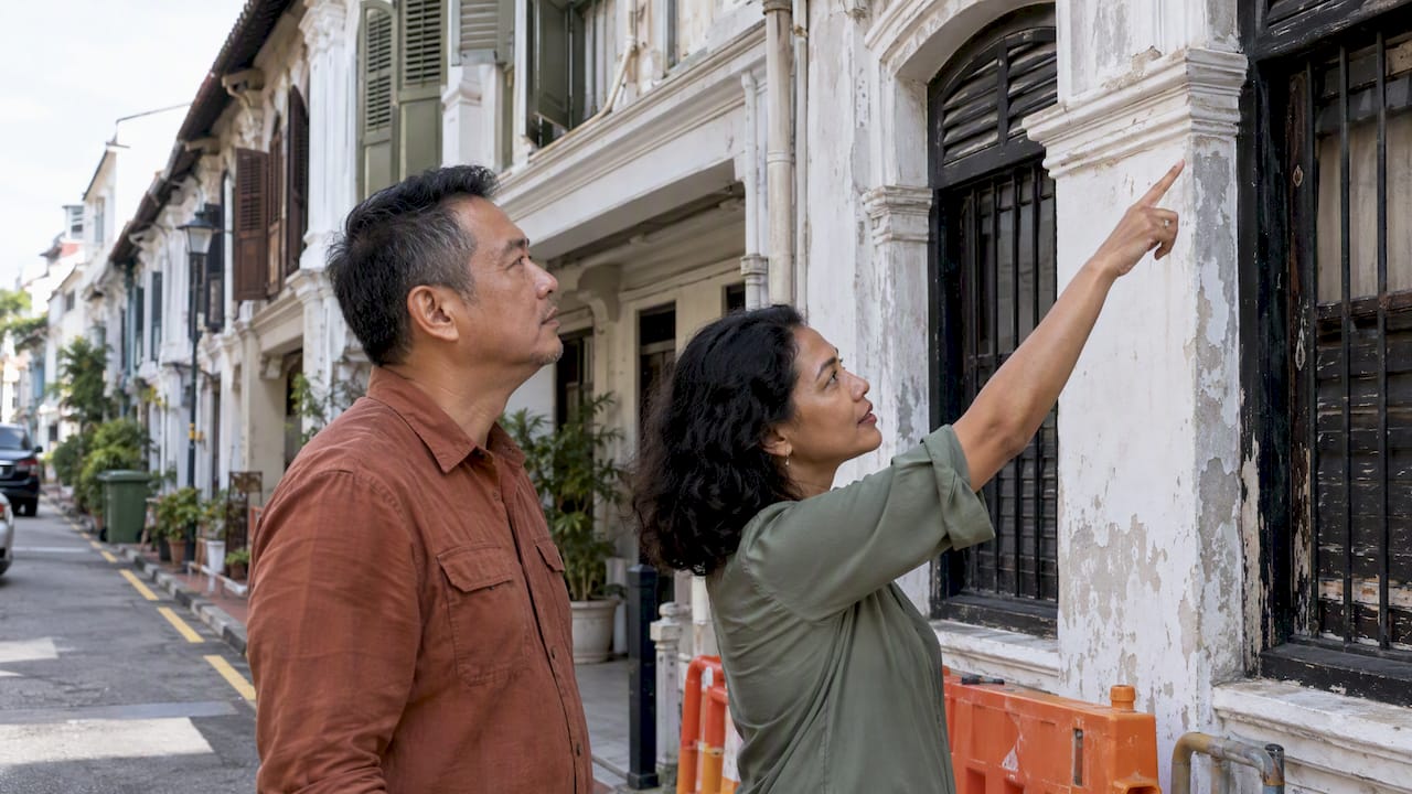 Owner and qualified person inspect shophouse façade